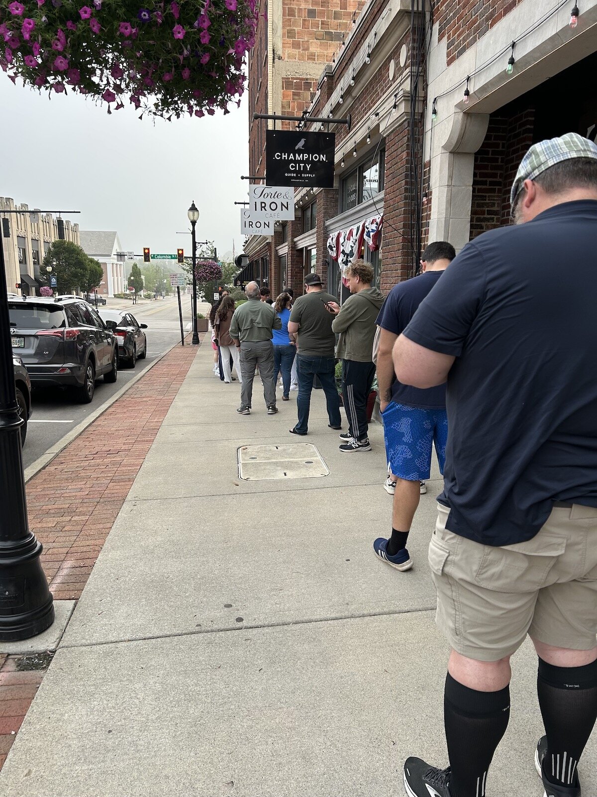 Customers line up for the grand opening of Torte & Iron Cafe.