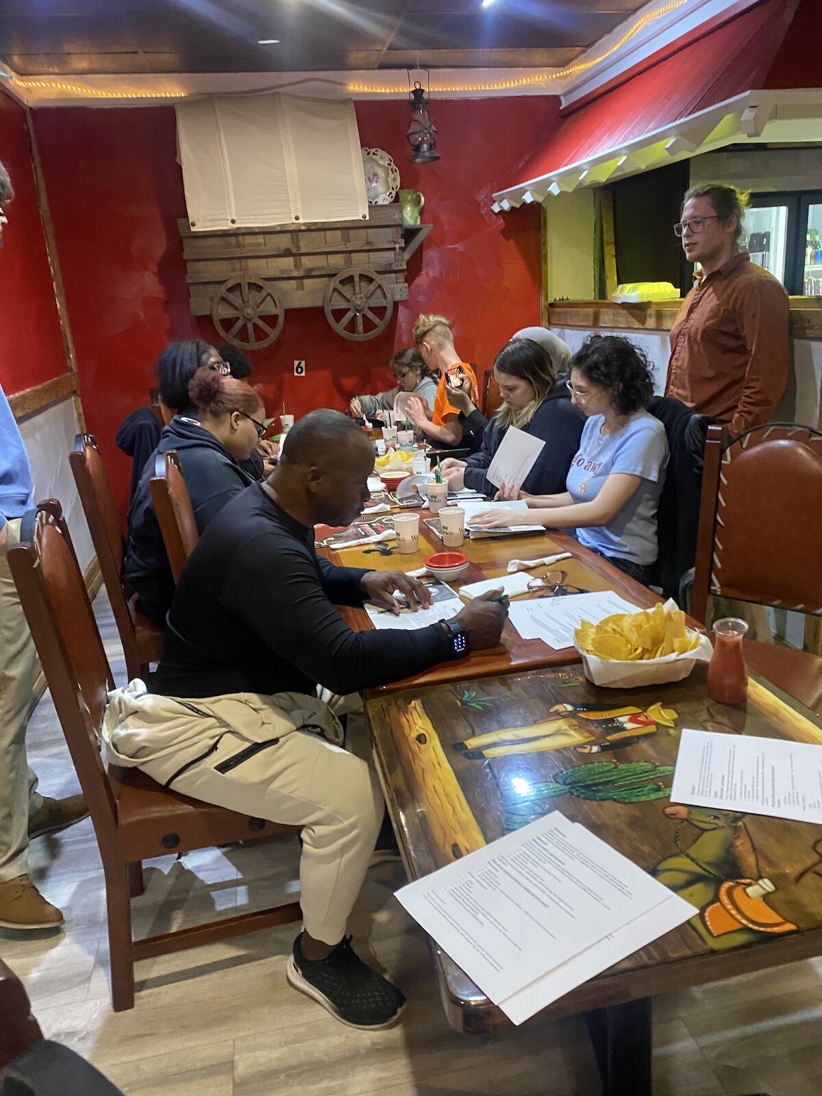 On-The-Rise participants complete an activity while out to eat.