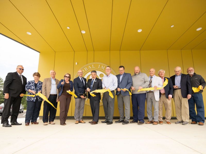 Representatives from Global Impact STEM Academy, Clark State, WSA Studio, MARKER construction, West Central Port Authority, New Carlisle Federal Savings Bank, and elected officials cut the ribbon for the new $16.9 million Upper Academy facility.