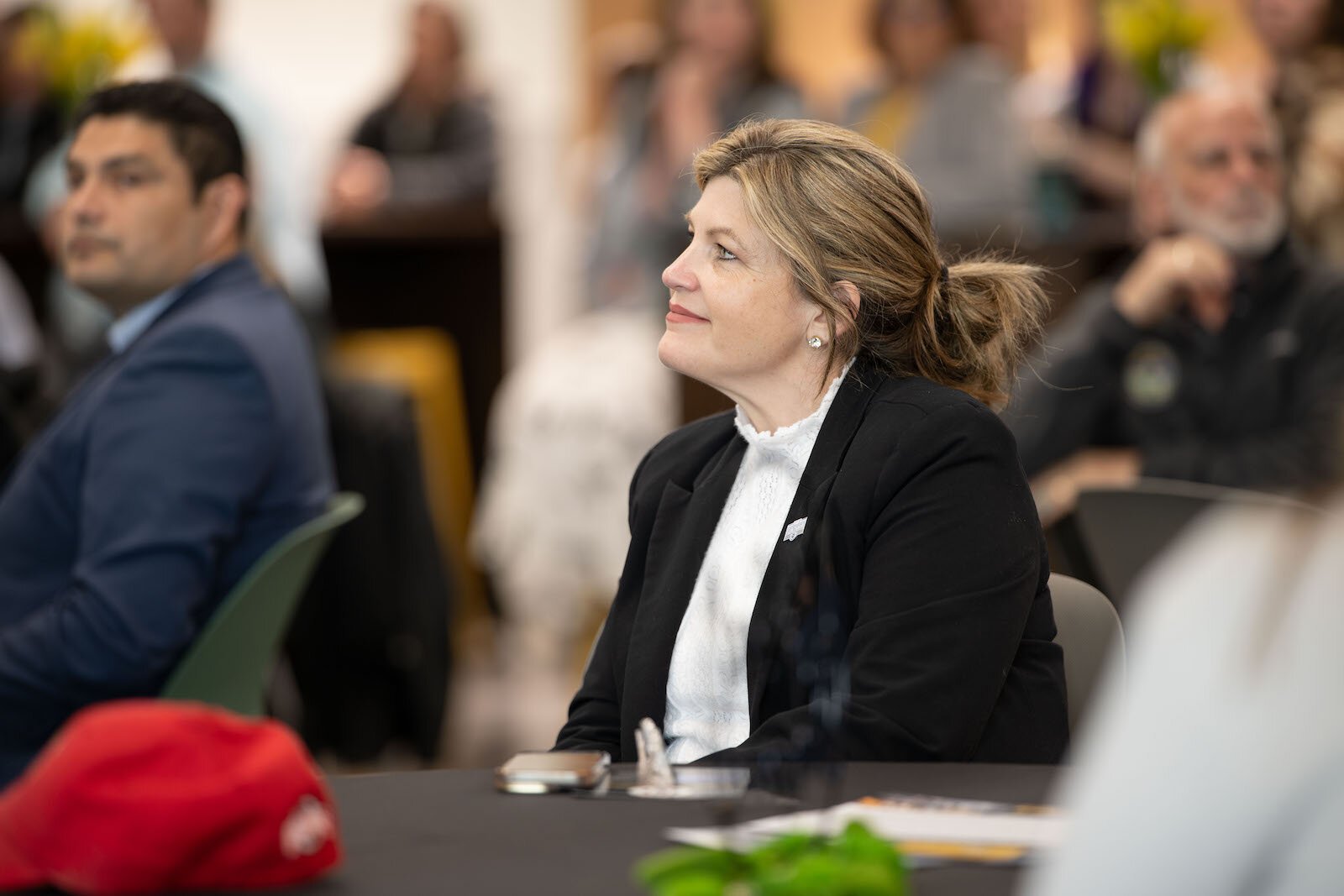 Springfield City Commissioner Tracey Tackett listens to remarks at Global Impact STEM Academy's ribbon cutting ceremony.