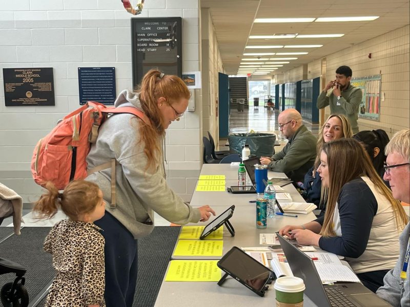 Parents and students visiting Springfield schools during orientation.