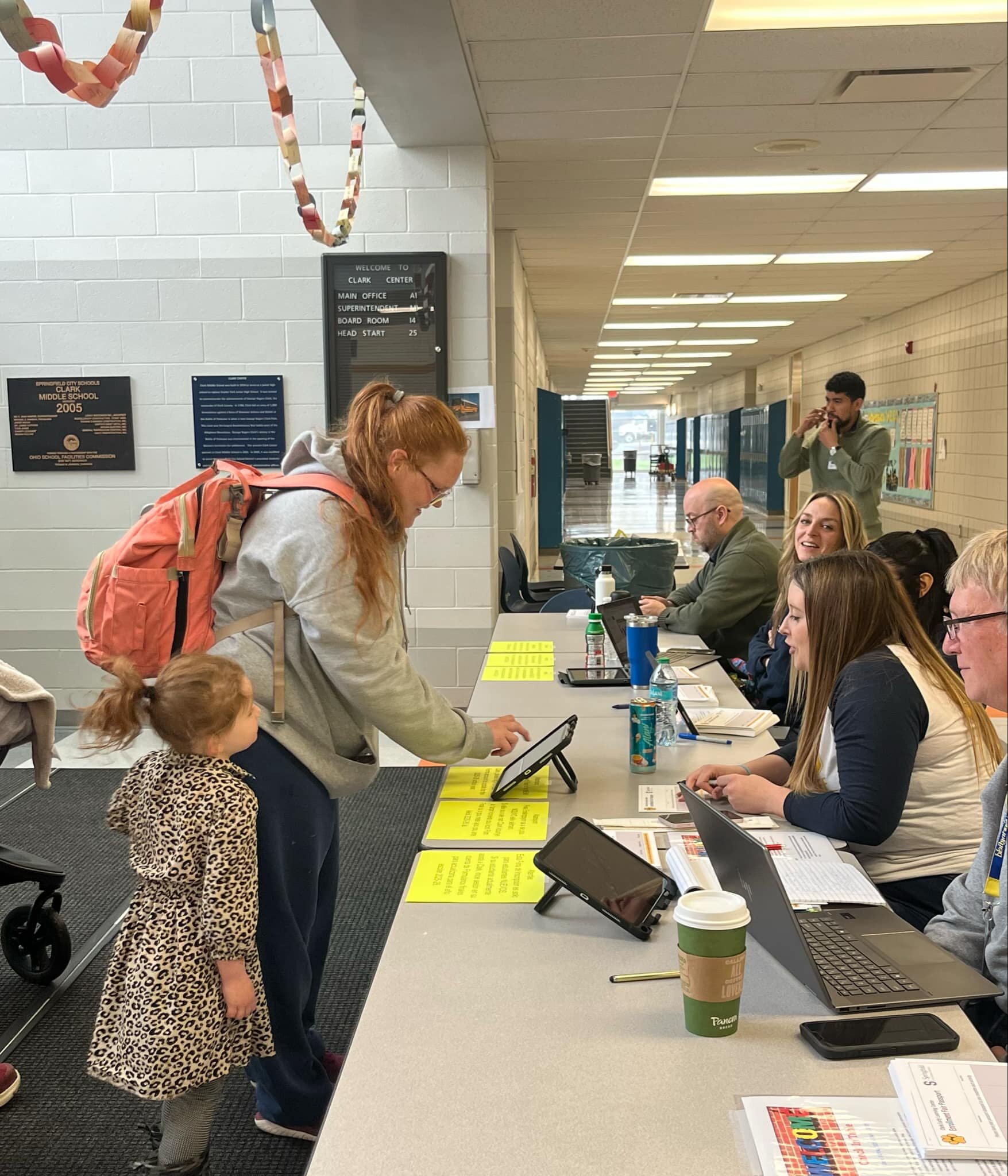 Parents and students visiting Springfield schools during orientation.