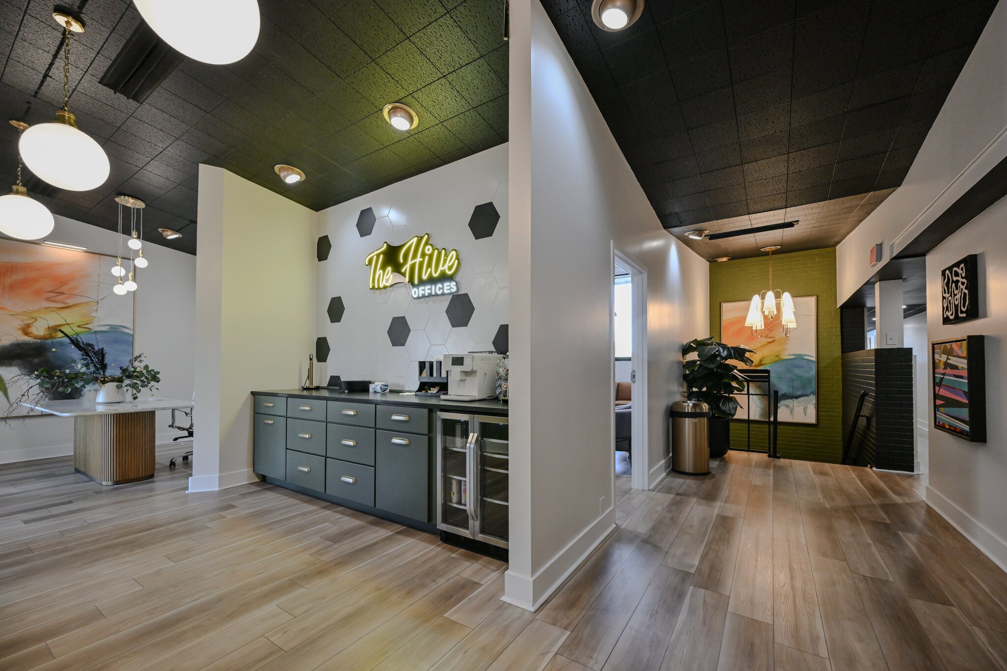 The Hive features a coffee bar, an espresso machine, snacks, and a drink fridge, inside its office and co-working spaces.